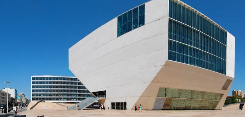 The angular white Casa da Música building under a blue sky