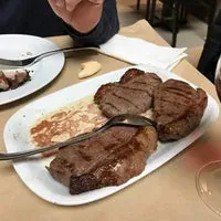 Thick grilled beef steaks served on a plate