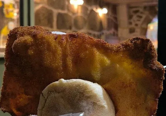 A large breaded pork cutlet in a bread roll