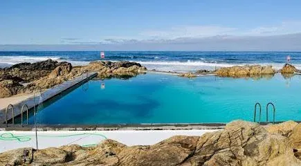 A turquoise ocean pool among the rocks by the sea