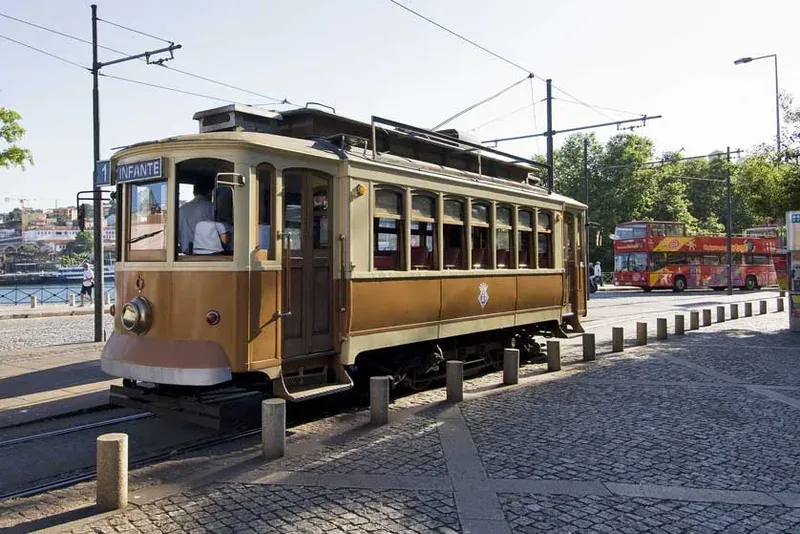 A vintage wooden tram on a cobbled street