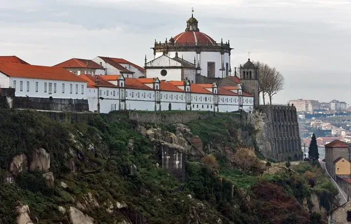 A domed monastery on top of a rocky hill